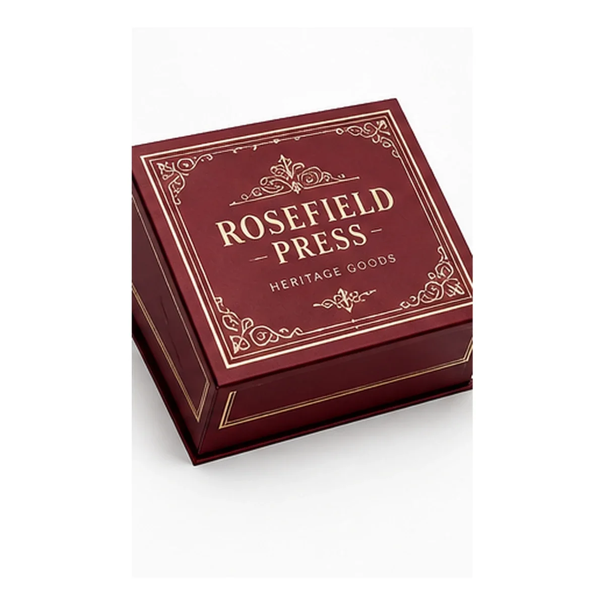 Closed burgundy ROSEFIELD PRESS magnetic gift box with cream ornamental borders and vintage serif lettering.