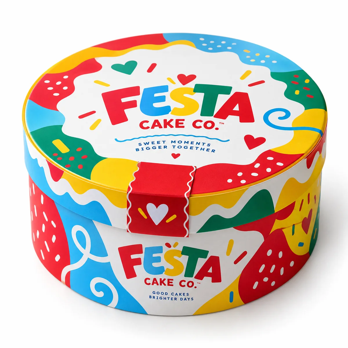 Multicolored round cake box with FESTA CAKE CO. branding, red printed closure band, playful hearts, and bold graphic shapes
