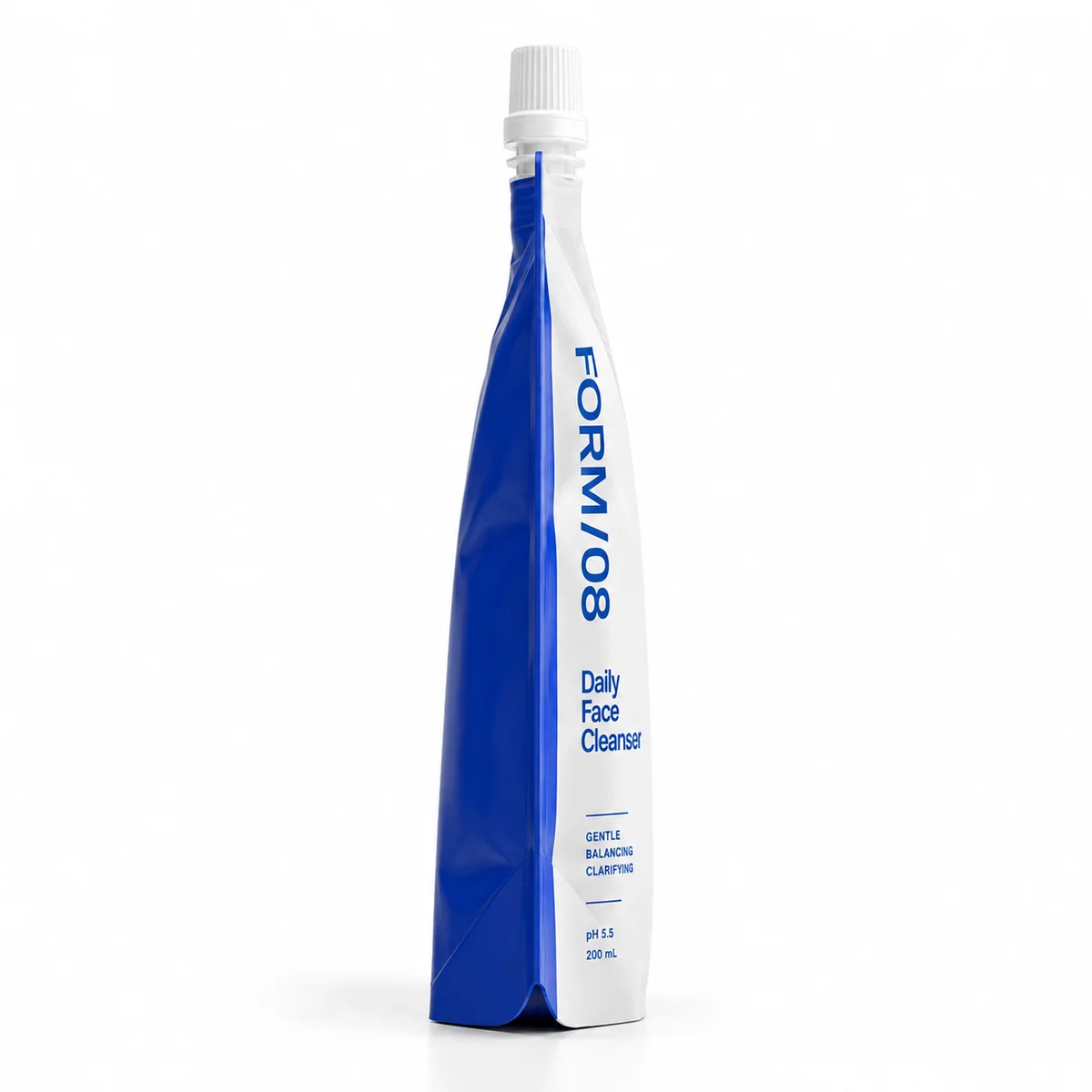Narrow side profile of a white and cobalt blue FORM/08 cleanser pouch with an upright white cap.