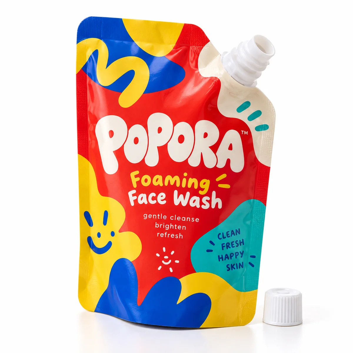 Bright red POPORA face wash refill pouch with playful blue and yellow graphics and a detached white cap.