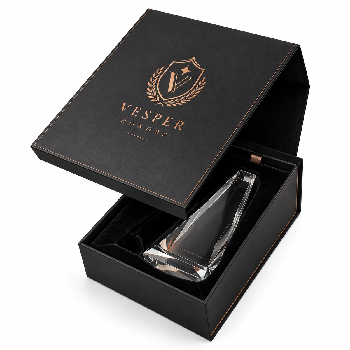 Charcoal black rigid award presentation box with copper-colored branding and a clear crystal trophy in a fitted velvet insert.