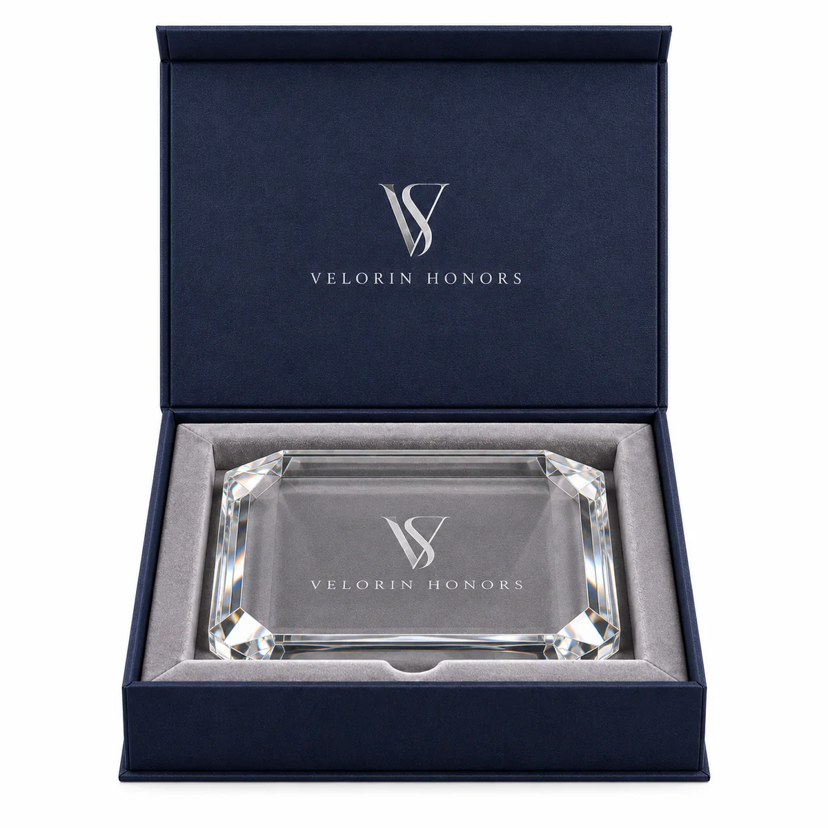 Straight-on view of an open navy award presentation box with silver VELORIN HONORS branding and a fitted crystal plaque.