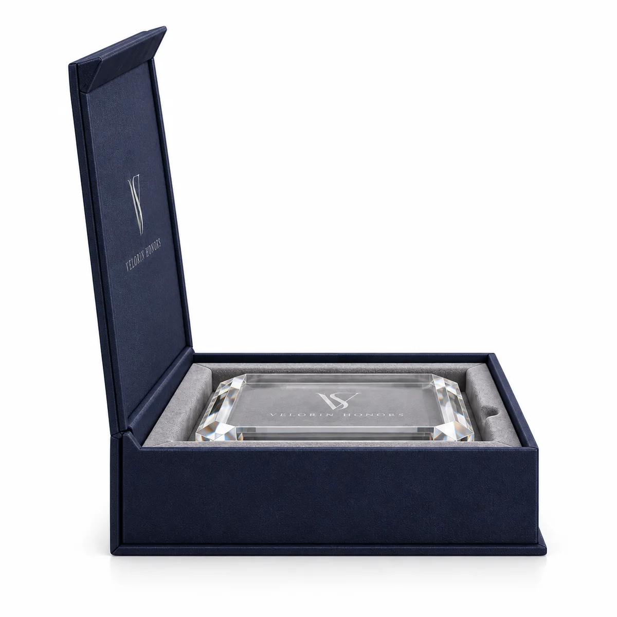 Side profile of an open navy rigid award presentation box showing its hinged lid, thick walls and recessed crystal award.
