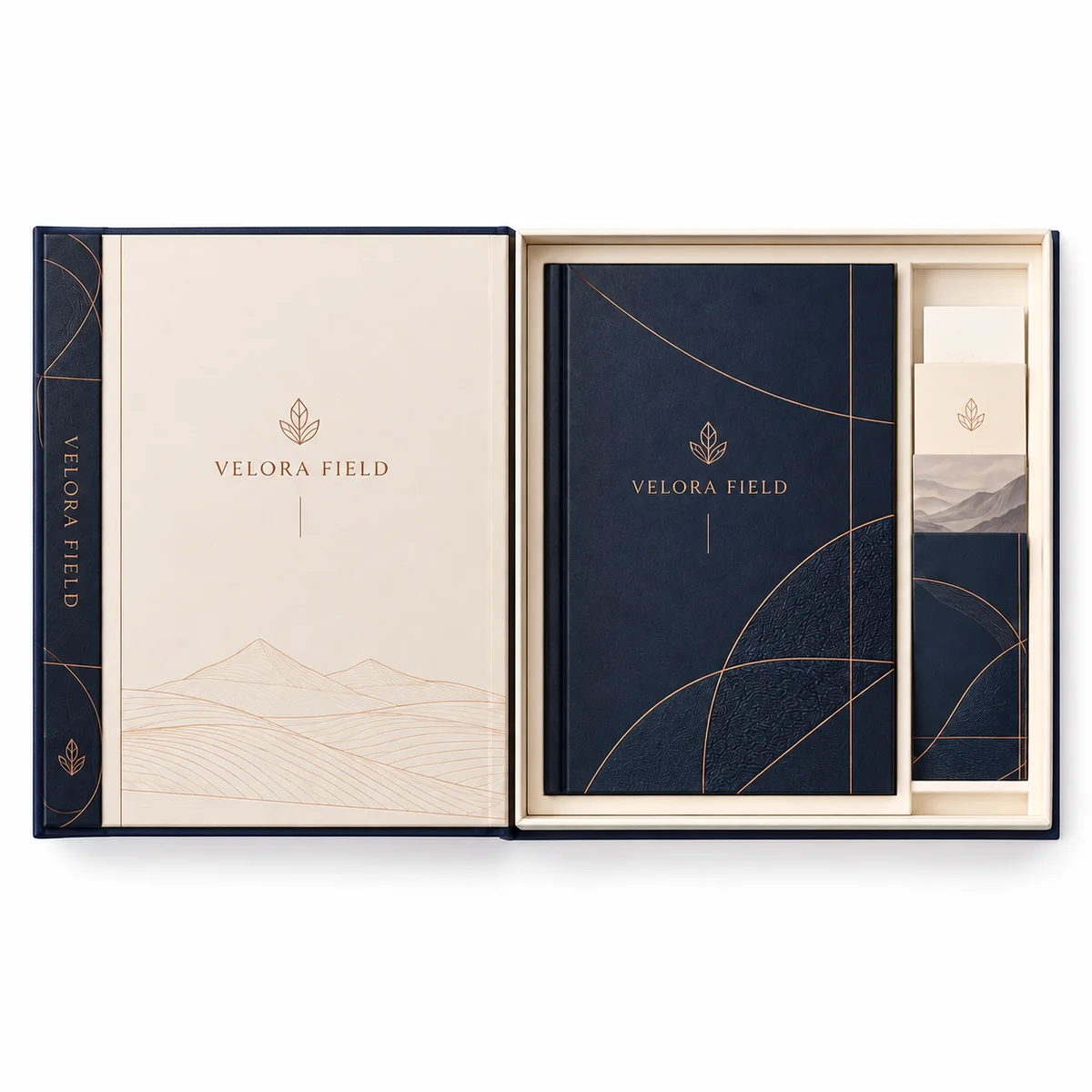 Top-down view of an open VELORA FIELD booklet box showing the ivory inner cover, navy booklet, and separate card compartment.