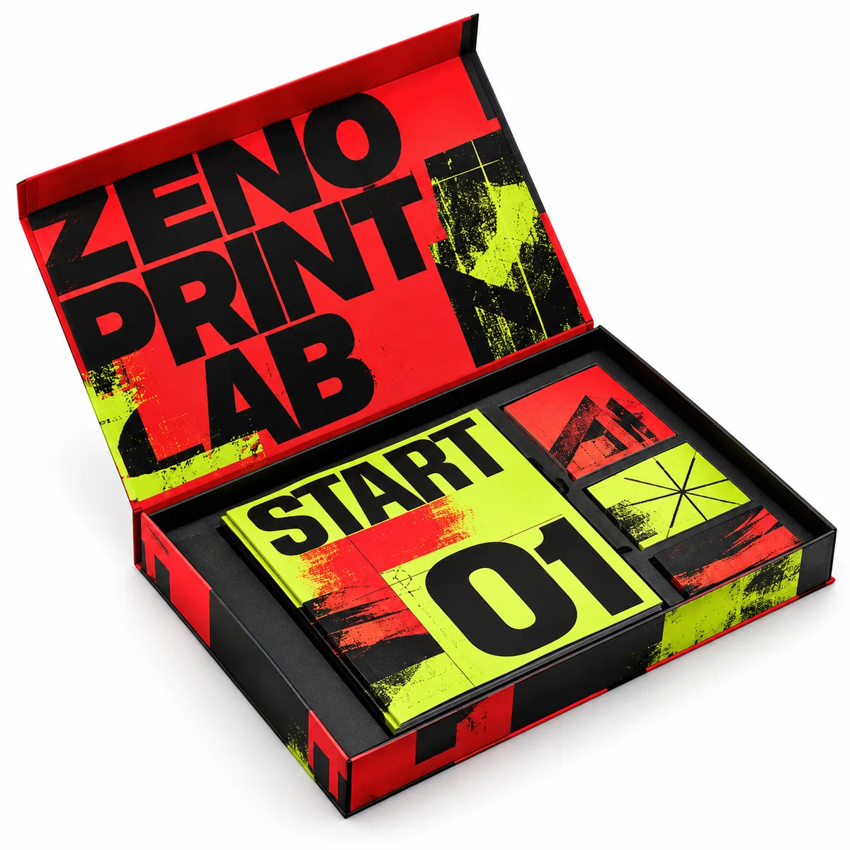 Open Zeno Print Lab booklet box with bold red, black, and neon yellow graphics, a START 01 booklet, and fitted card compartments.