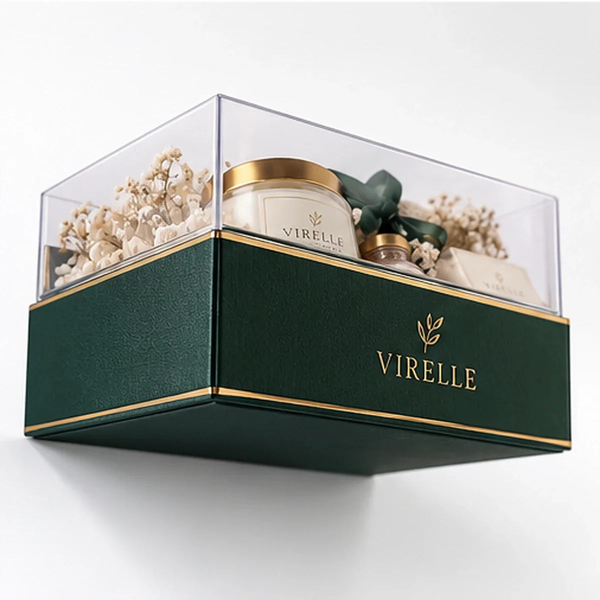 Low-angle view of VIRELLE custom clear lid gift box with raised transparent cover, green gold-lettered base and candle arrangement.