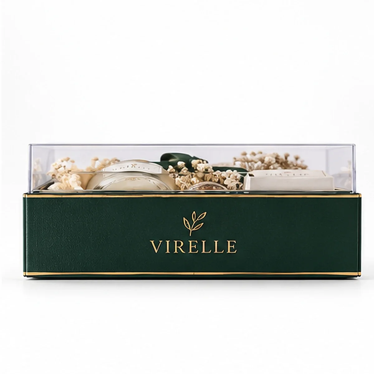 Side profile of VIRELLE clear lid gift box showing the transparent cover, dark green branded tray and candle gift items inside.