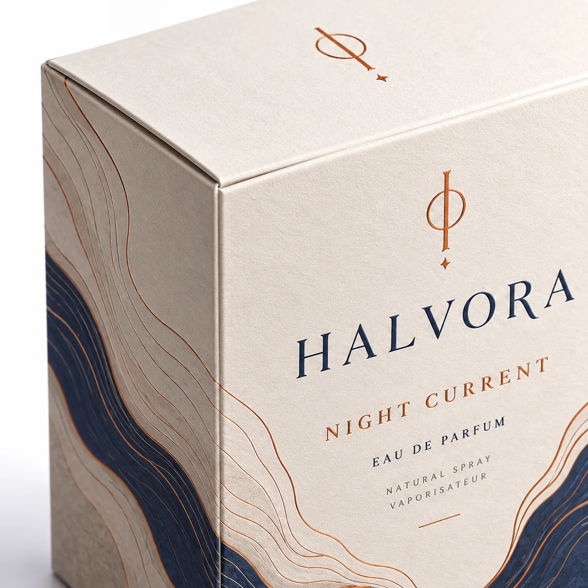 Close-up of HALVORA custom cologne packaging showing textured paperboard, copper accents, crisp carton folds and navy artwork.