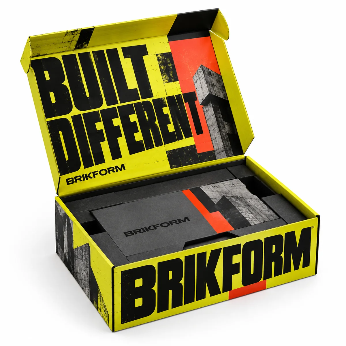 Open BRIKFORM flip top box featuring vivid yellow panels, oversized black lettering, red accents and a dark fitted insert.