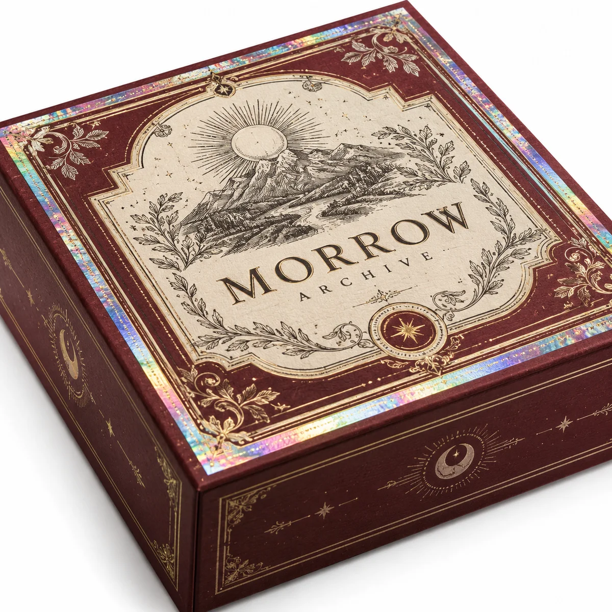 Close-up of a burgundy Morrow Archive rigid keepsake box with engraved landscape artwork and an iridescent decorative border.