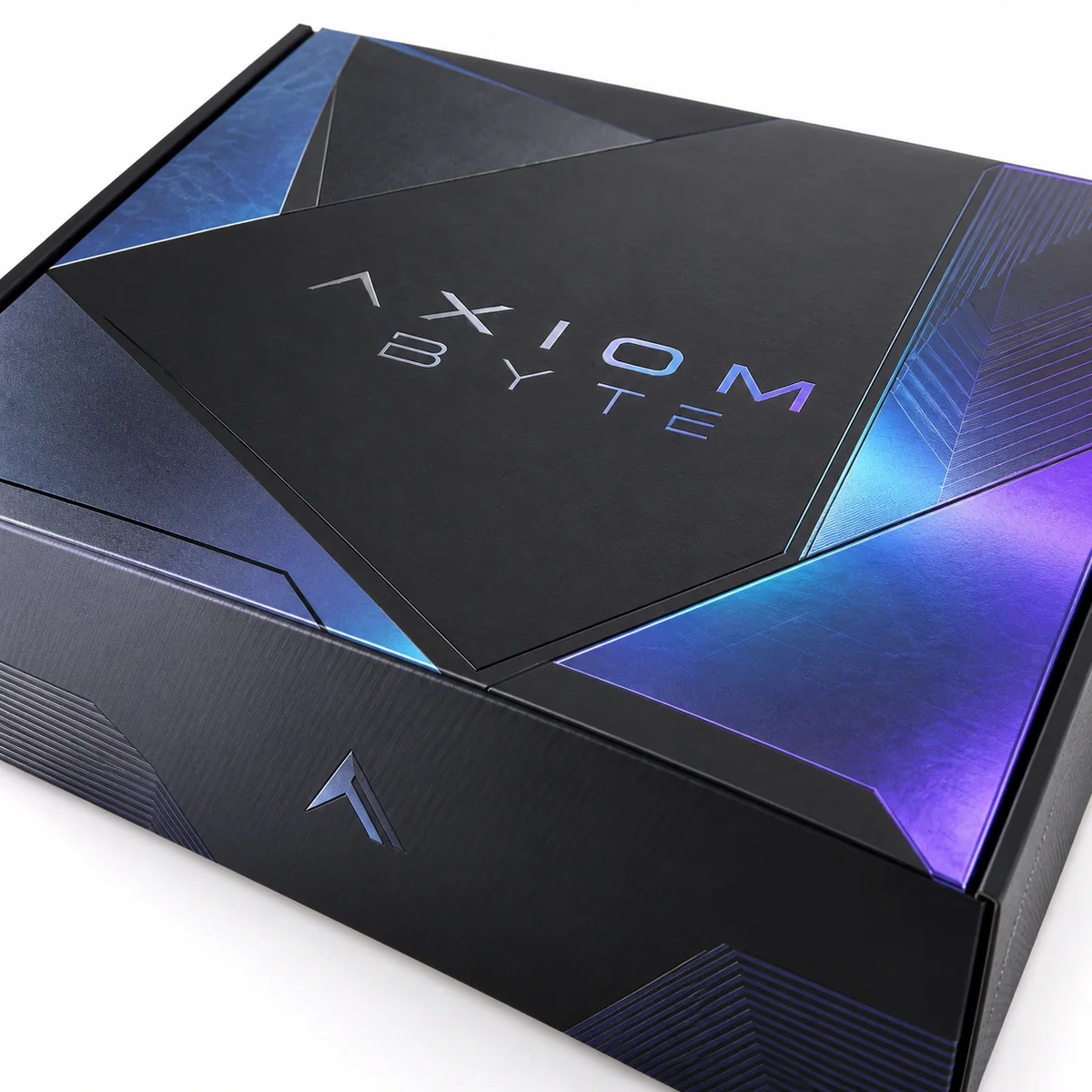 Close-up of black influencer kit packaging with Axiom Byte branding, angular blue-violet graphics and reflective print details.