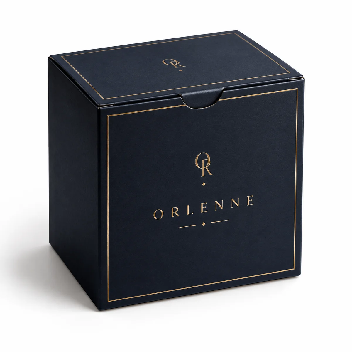 Navy ORLENNE custom tuck top gift box with thin gold borders and elegant serif branding, photographed from an elevated angle.