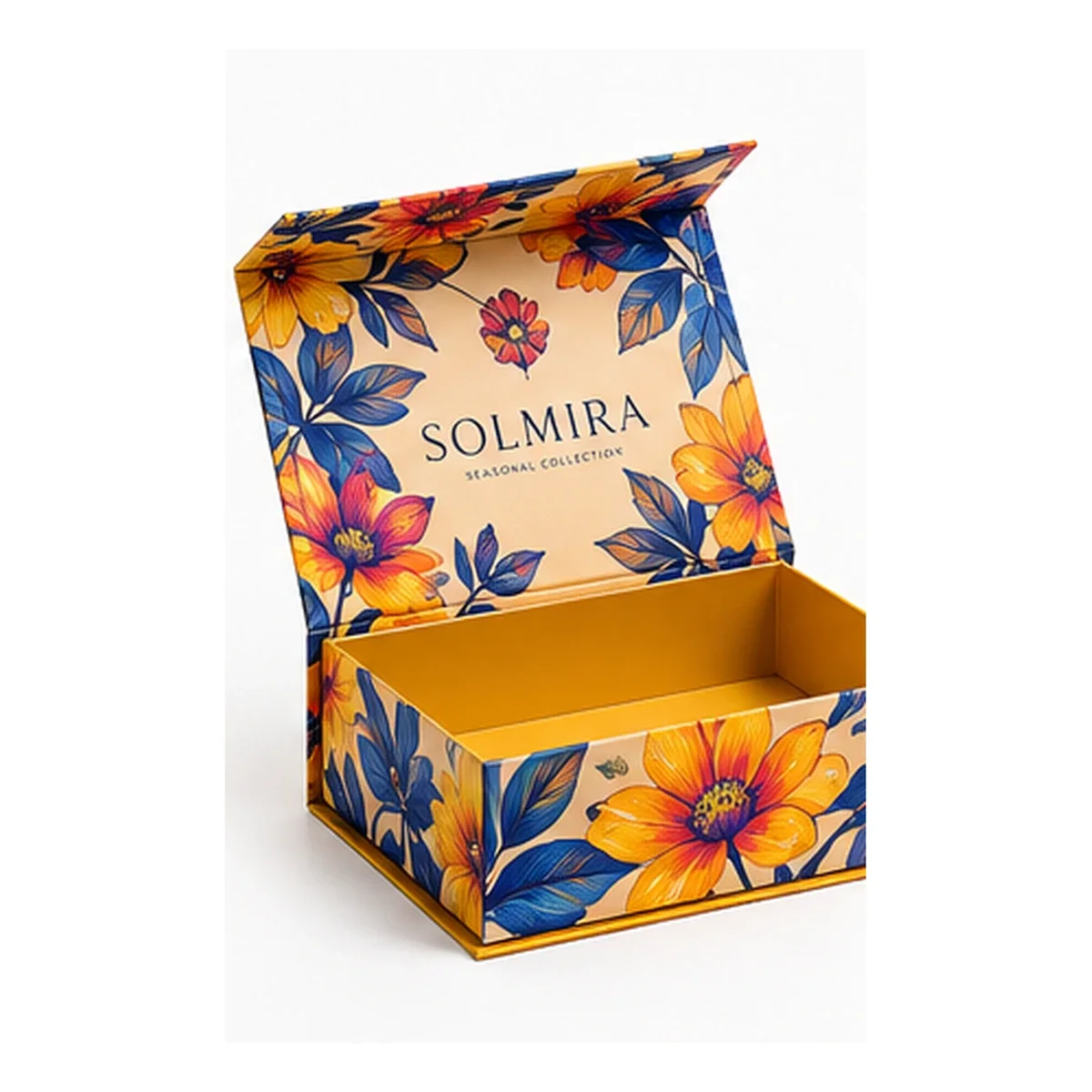 Open SOLMIRA magnetic gift box wrapped in colorful orange, yellow, and blue floral artwork with a golden interior.