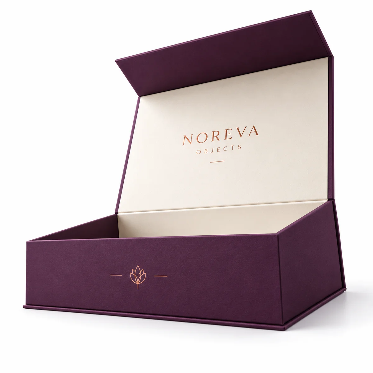 Low-angle view of an open plum magnetic closure box with sturdy rigid walls, copper front emblem, and ivory-lined lid.