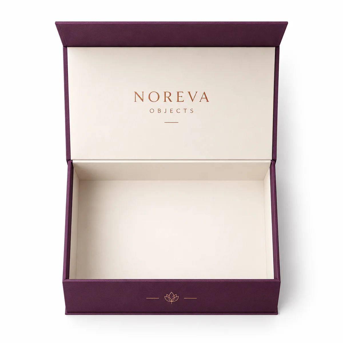 Overhead view of an open plum magnetic closure box with ivory lining and copper branding inside its hinged lid.