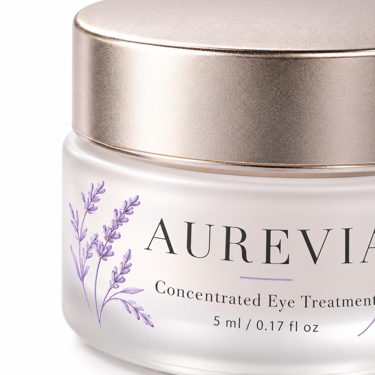 Macro detail of an AUREVIA 5ml cosmetic jar showing the champagne lid edge, frosted glass, typography, and lavender artwork.