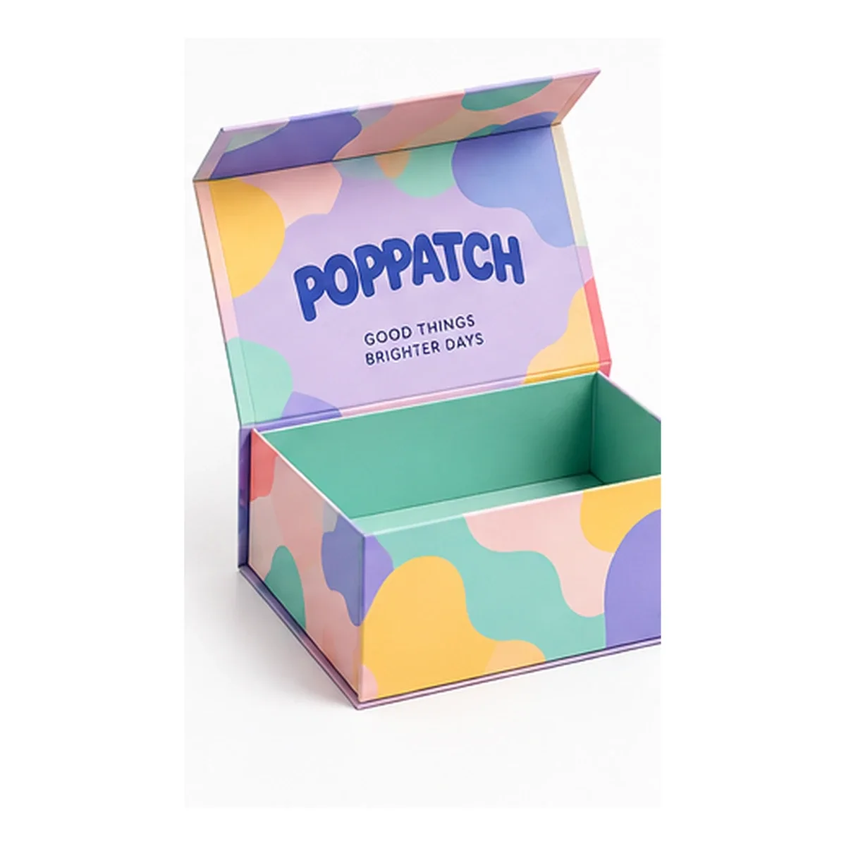 Open POPPATCH magnetic gift box covered in lavender, peach, and mint abstract shapes, with blue lettering.