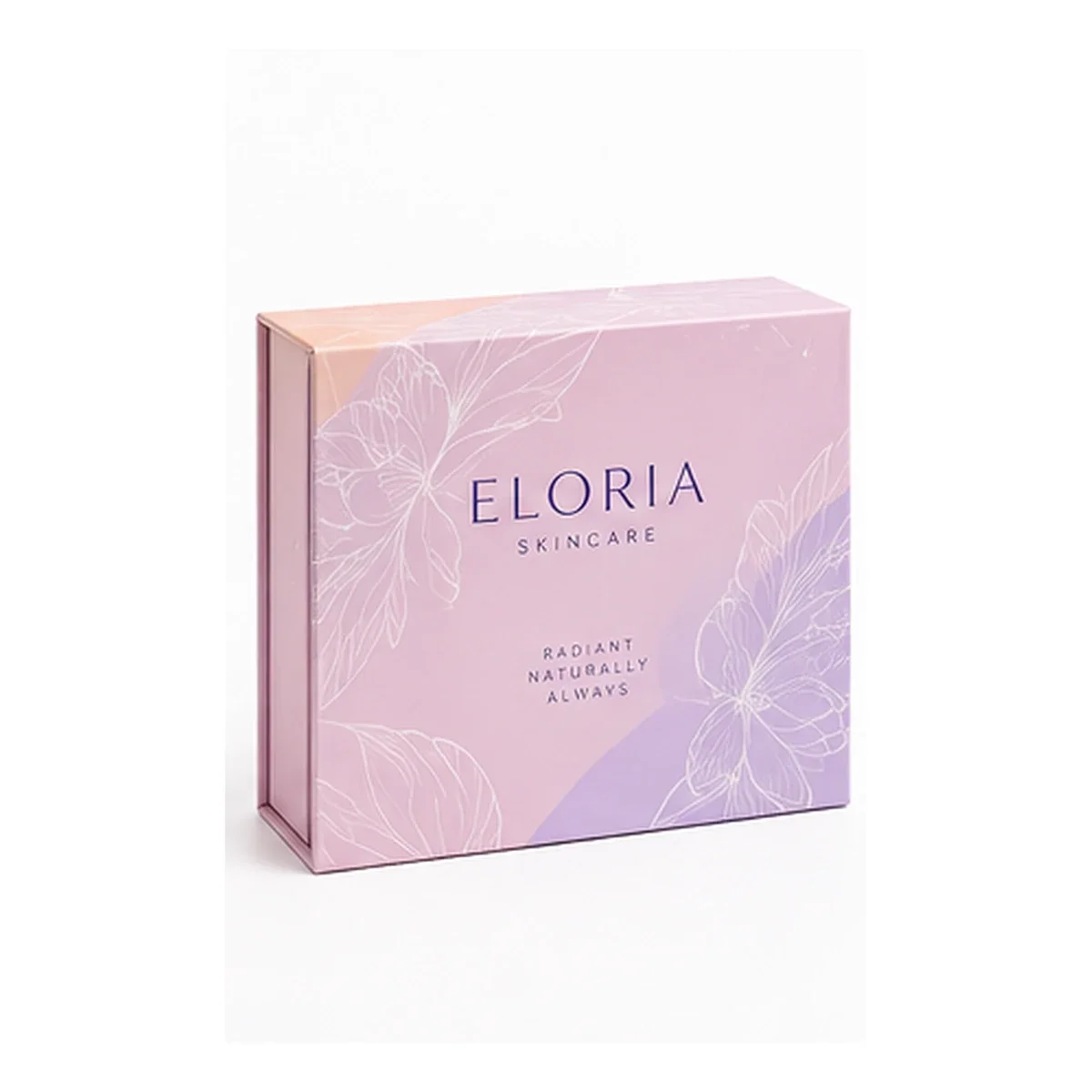 Closed pastel-pink ELORIA magnetic gift box with delicate white floral line art and centered skincare branding.