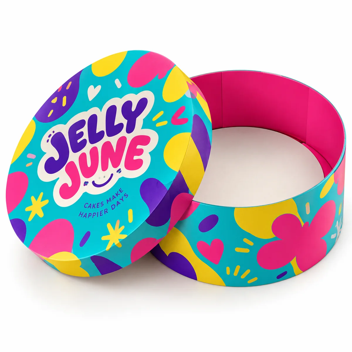 Open round cake box with JELLY JUNE lettering, turquoise exterior, pink interior, and colorful abstract birthday graphics